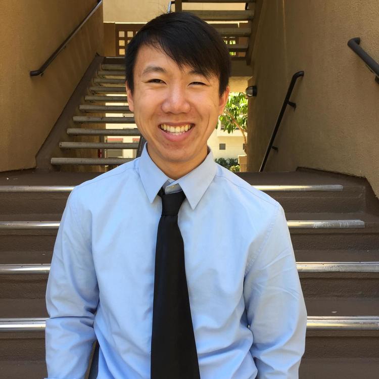 Lab Manager Danny Standing in front of Stairs
